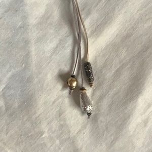 Leather and mixed metal lariat necklace.